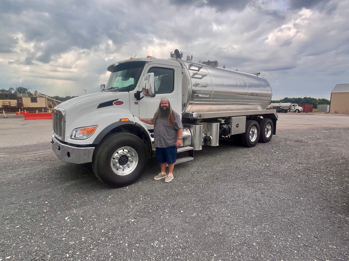 Owner of Central Pumping Services with the company pump truck in West Tennessee