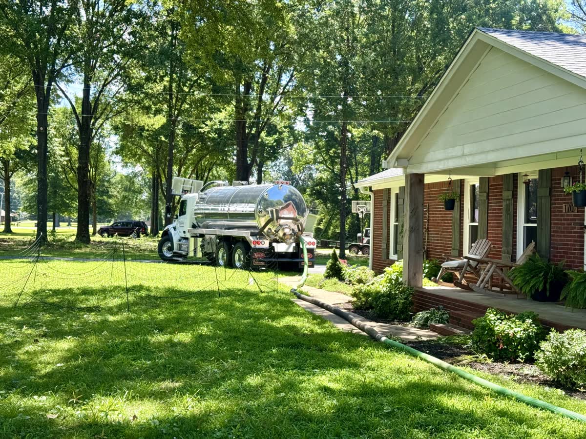 Open septic tank during pumping service near Covington, Tennessee